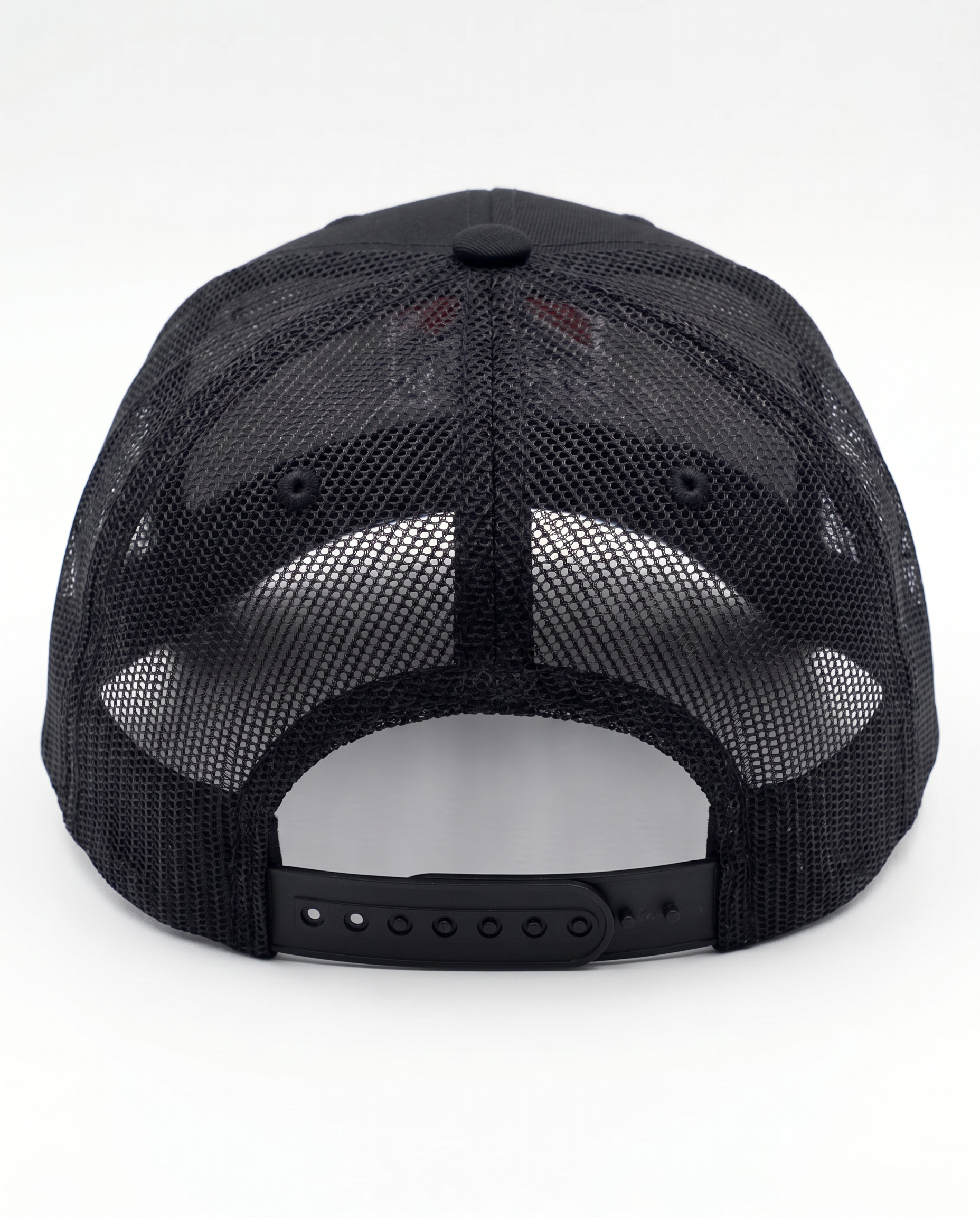 Black trucker cap shown from the back, featuring a black mesh back and an adjustable snap closure.